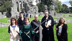 Image of tourists in front of abbey