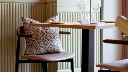 A table and two chairs in a restaurant