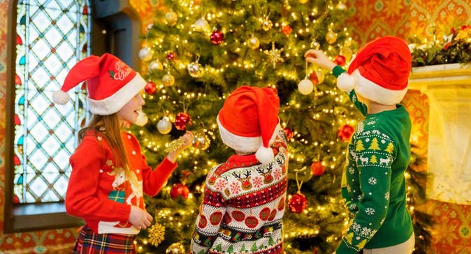 Young visitors at the Christmas tree in the formal hall of Turlough Park House. Image: John Mee
