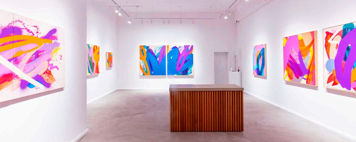 Contemporary exhibition of paintings with mainly purple and blue hues