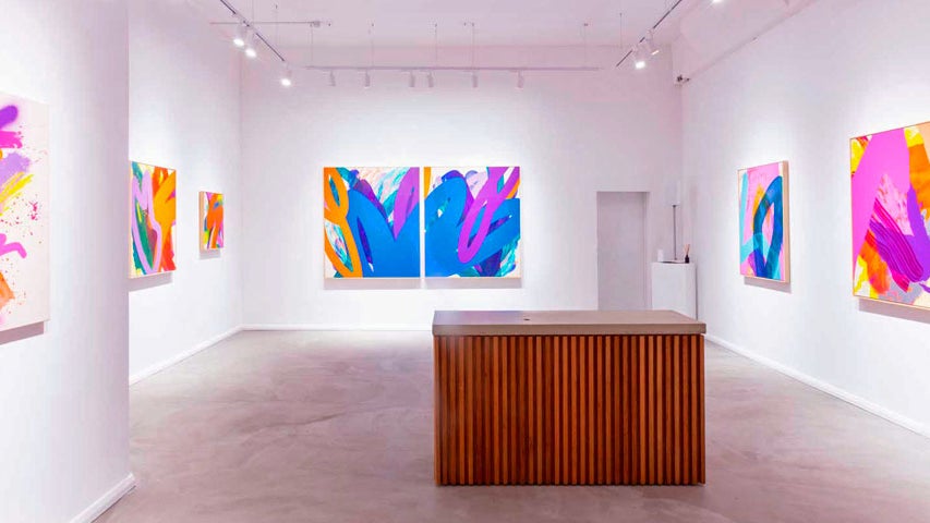 Contemporary exhibition of paintings with mainly purple and blue hues