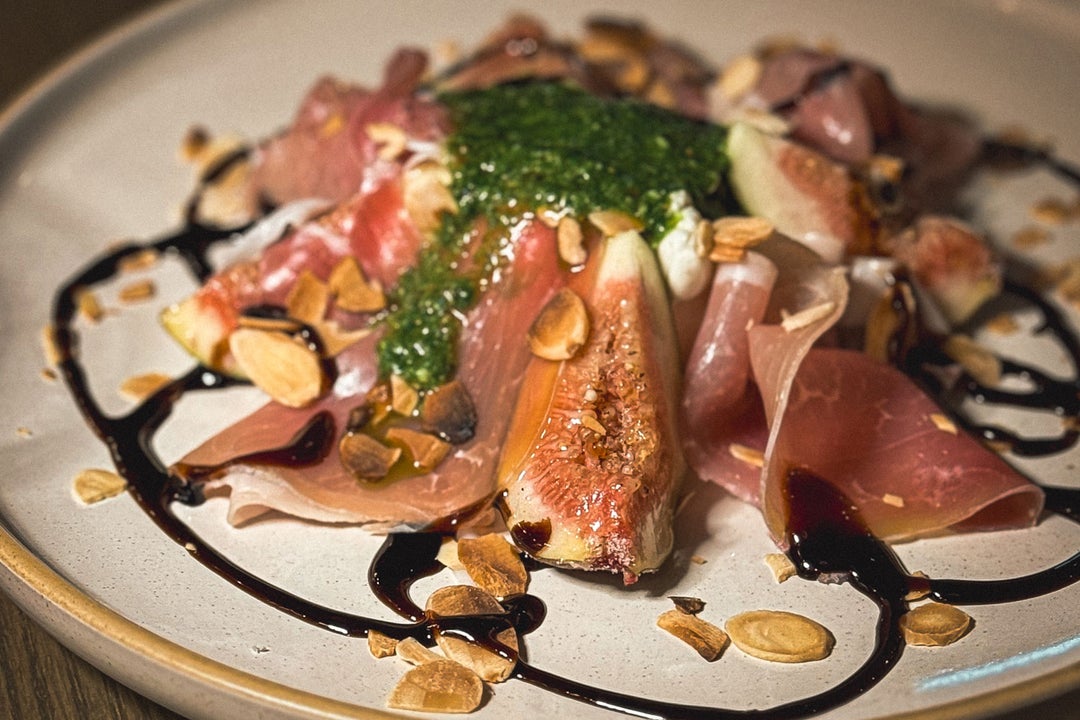 A dish of caramelised figs and Parma ham from the menu at TONI