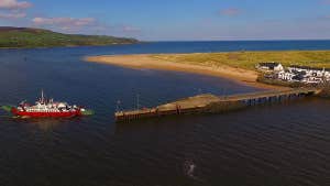 Image of ferry arriving at island port.