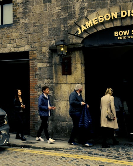 A group of people entering the Bow Street distillery