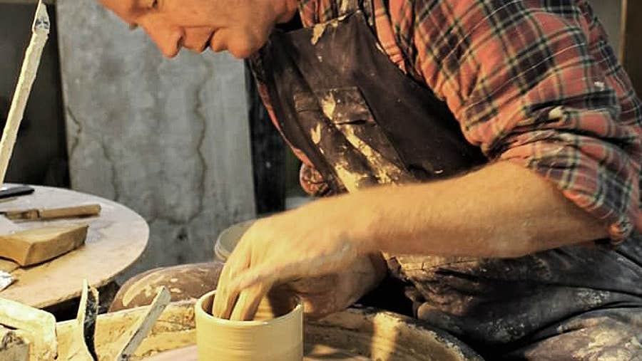 Benbulben Pottery showing Dave McLoughlin at the potters wheel