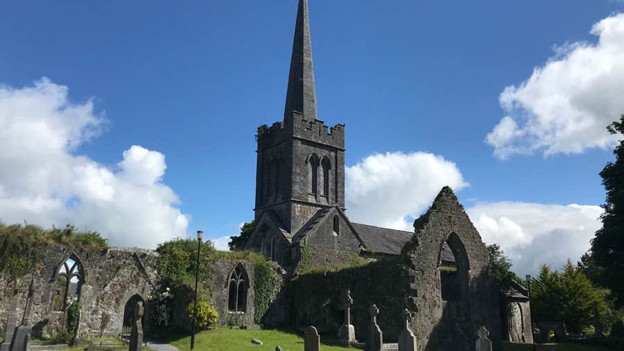 Exterior view of Athenry Arts and Heritage Centre with graveyard in front