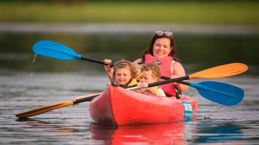 Woman and children kayaking in Lough Oughter, Cavan