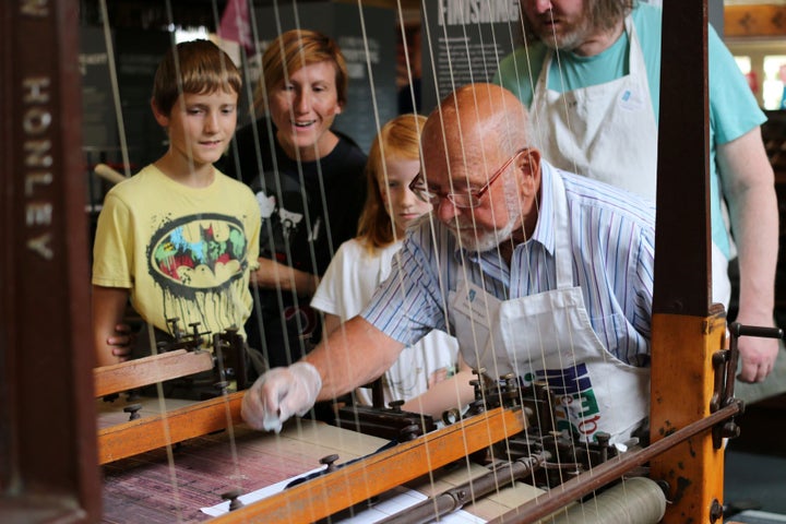 Science Demo Day at National Print Museum - a man demonstrating an old machine to onlooking children.