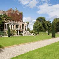 Exterior photo of Huntington Castle and Gardens with blue skies