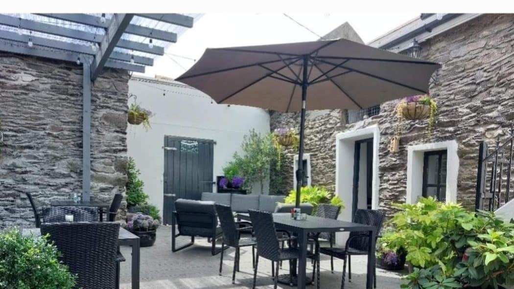 A view of the outdoor dining area and beer garden at The Wild West Bar