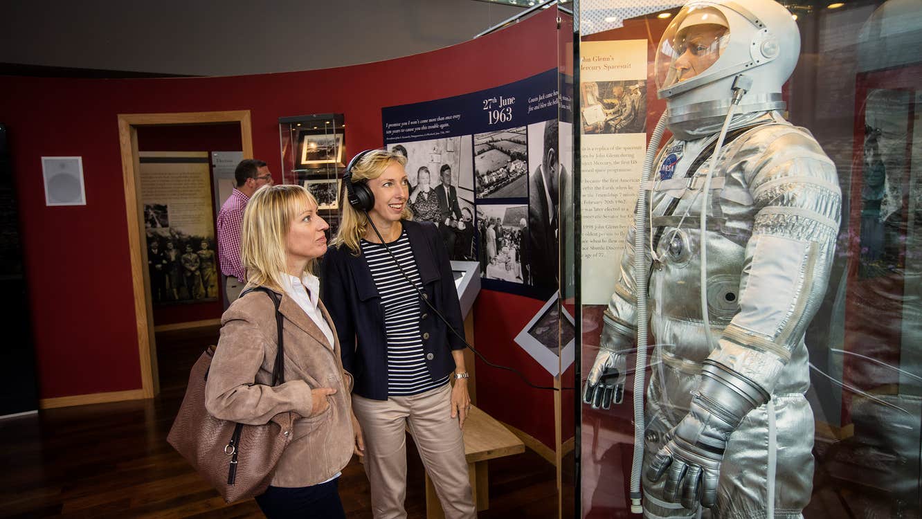 Two women looking at an exhibition at The Kennedy Homestead in County Wexford.