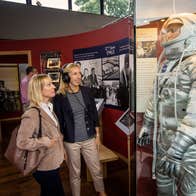 Two women looking at an exhibition at The Kennedy Homestead in County Wexford.