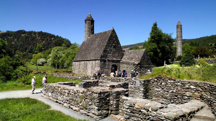 People visiting the ruins of the church on St Kevin's Pilgrim Path in Glendalough, Co Wicklow
