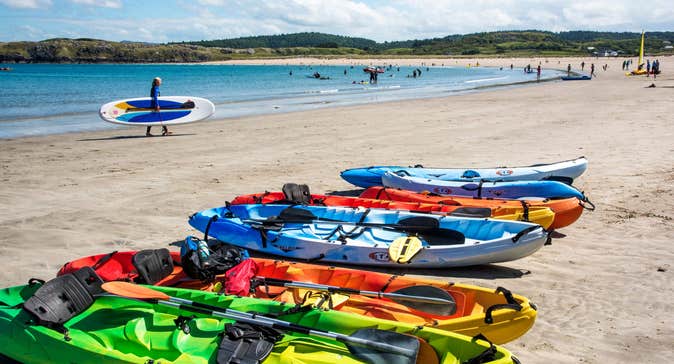 Colourful kayaks on the sand at Marble Hill Beach, Co Donegal