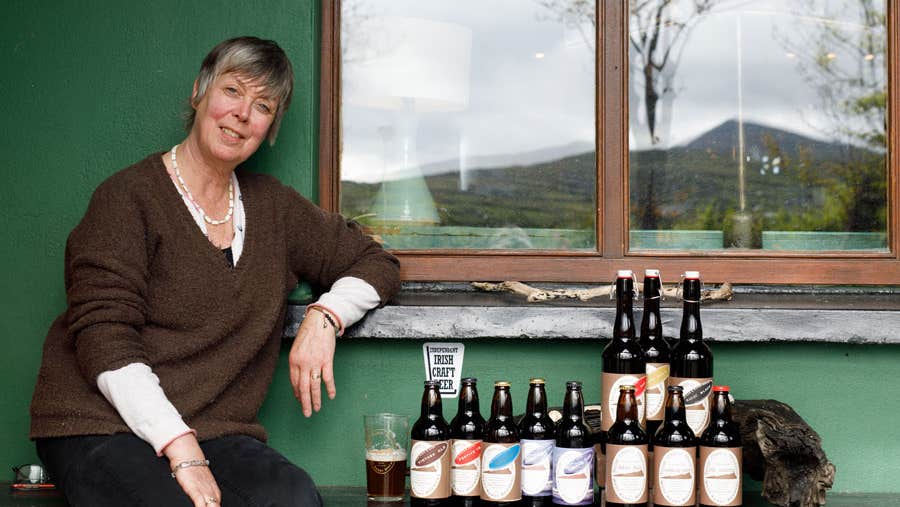 Adrienne Heslin with a display of crafted beers by West Kerry Brewery