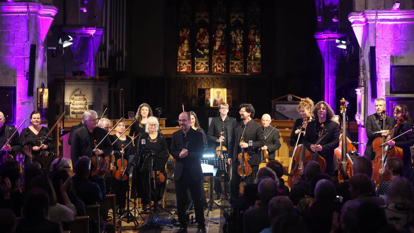 The Luminosa String Orchestra standing after their performance at St Nicholas' Collegiate Church, Galway