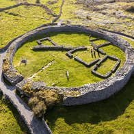 Aerial view of a stone ring fort surrounded by fields