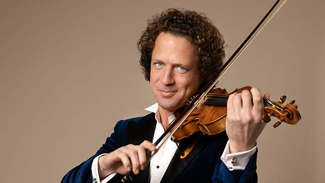 Violinist Vladimir Jablokov, a smiling man playing a violin