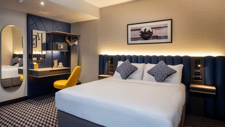 Bedroom with yellow chair.