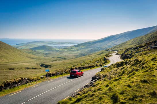 Car driving on the road on the Connor Pass, County Kerry