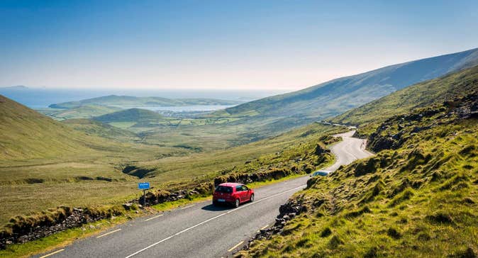 Car driving on the road on the Connor Pass, County Kerry