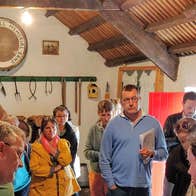 Gael Linn Irish Language Classes for Adults group visiting a traditional cottage