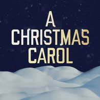 A Christmas Carol reads in glowing golden letters, on a dark night sky with snow beneath it.