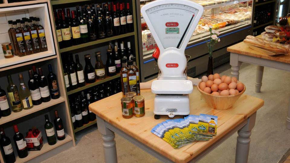 A scales and grocery items in Benny's Deli