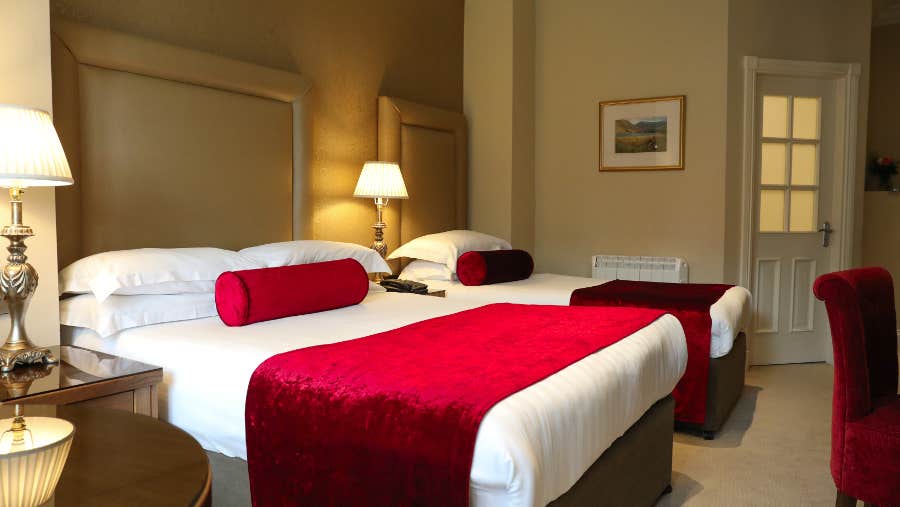 Bedroom with white and red sheets