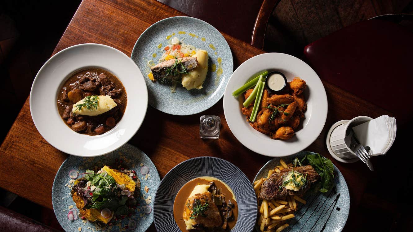 A selection of main courses on a table served at Nancy Hands Bar & Restaurant
