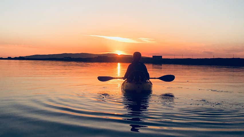 Canoe at sunset at Maghery Coastal Adventures County Donegal