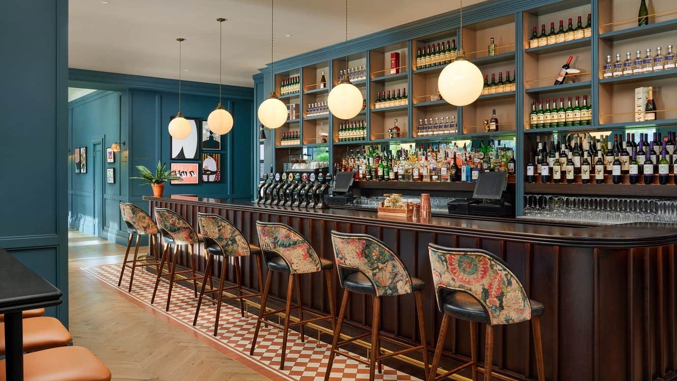 An empty bar with comfortable seating and décor