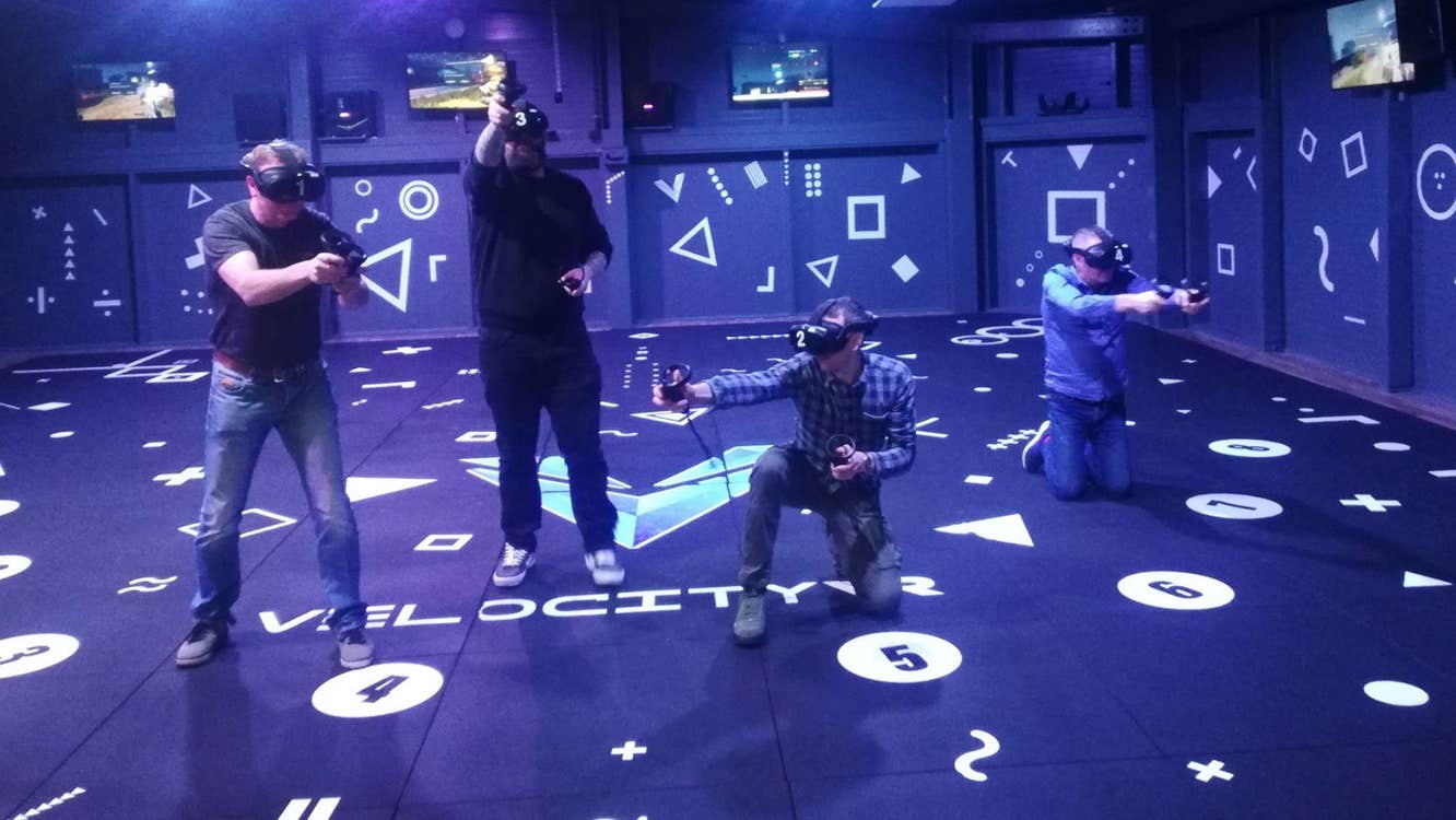 People participating in a Velocity Virtual Reality escape room