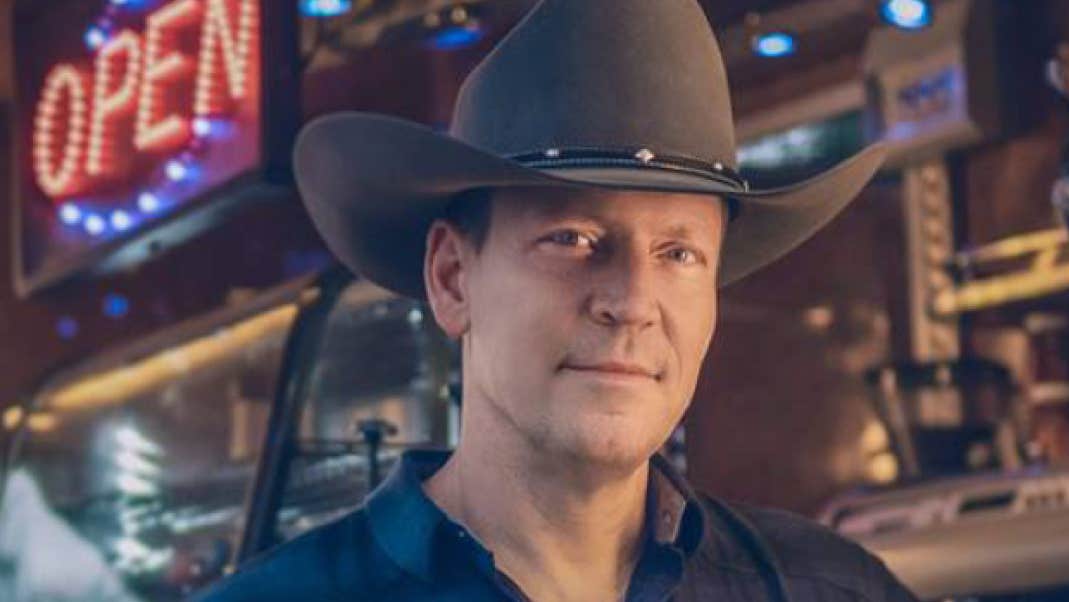 Robert Mizzell Dance - Gleneagle Arena, a gently smiling man in a brown cowboy style hat.