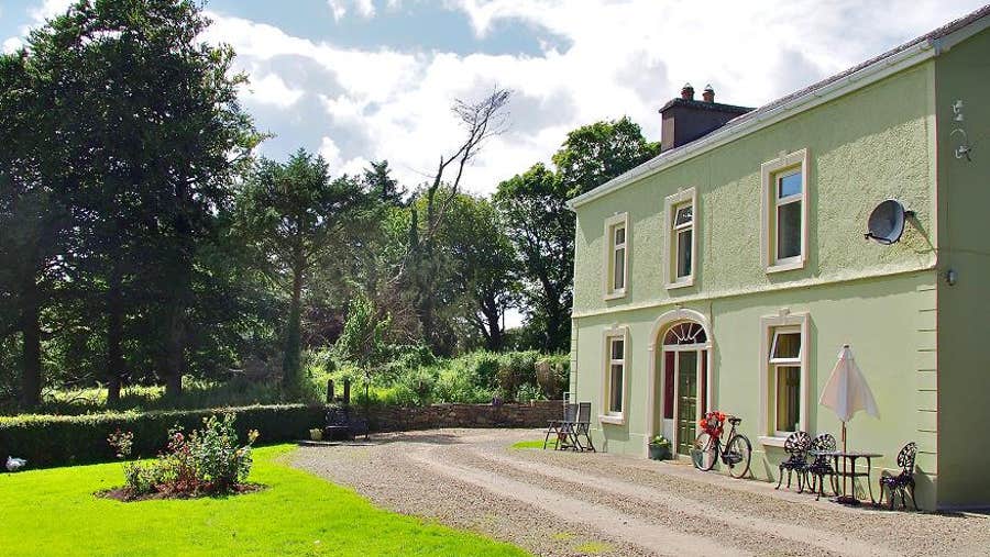 Front view of property with seating area