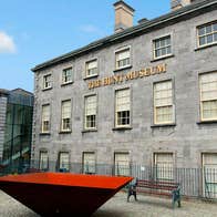 The Hunt museum with large red and black piece of artwork and painted ceramic horse in the foreground