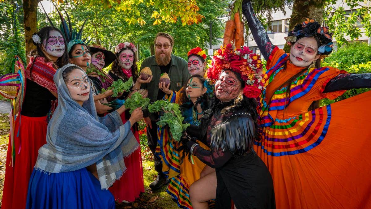 Traditional Catrina makeup, colorful costumes, dancing, and live music