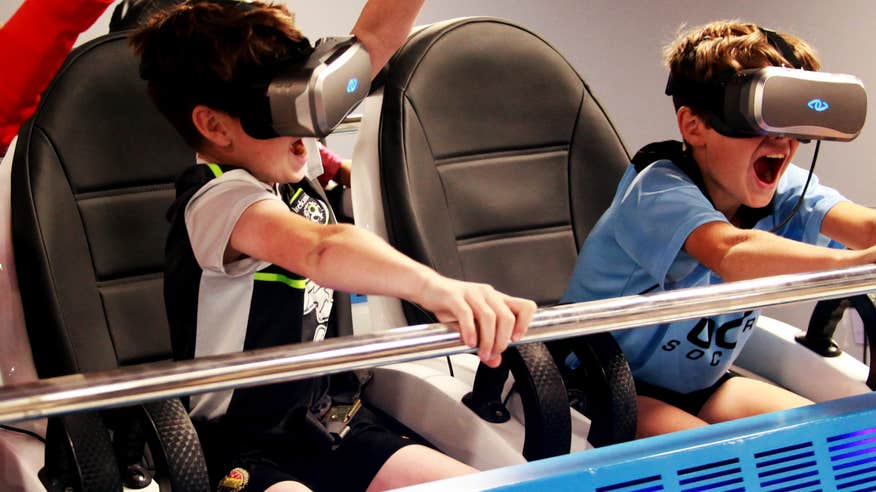 Kids using a VR headset at the Explorium.