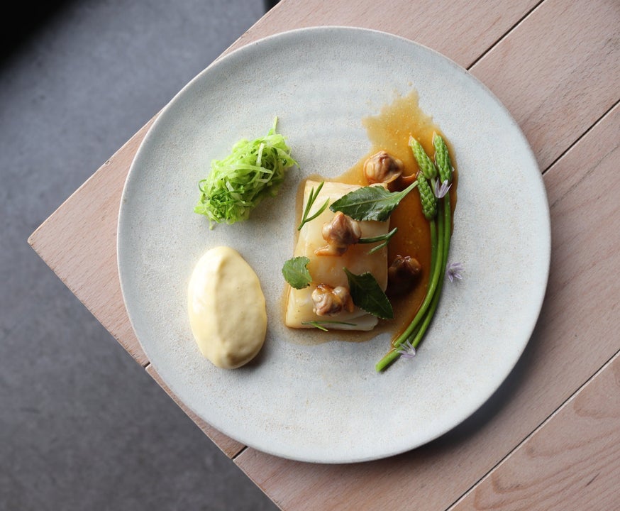 A cod cockles mushroom and cep sauce dish served at Bastible