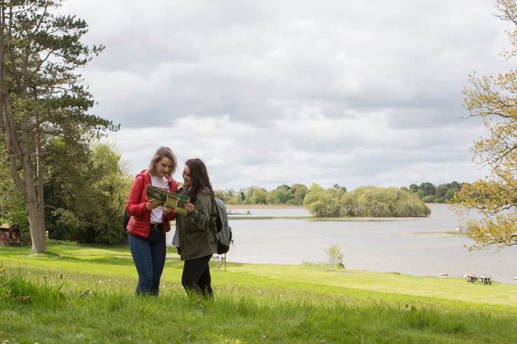 Two people exploring the grounds of Belvedere House, Westmeath
