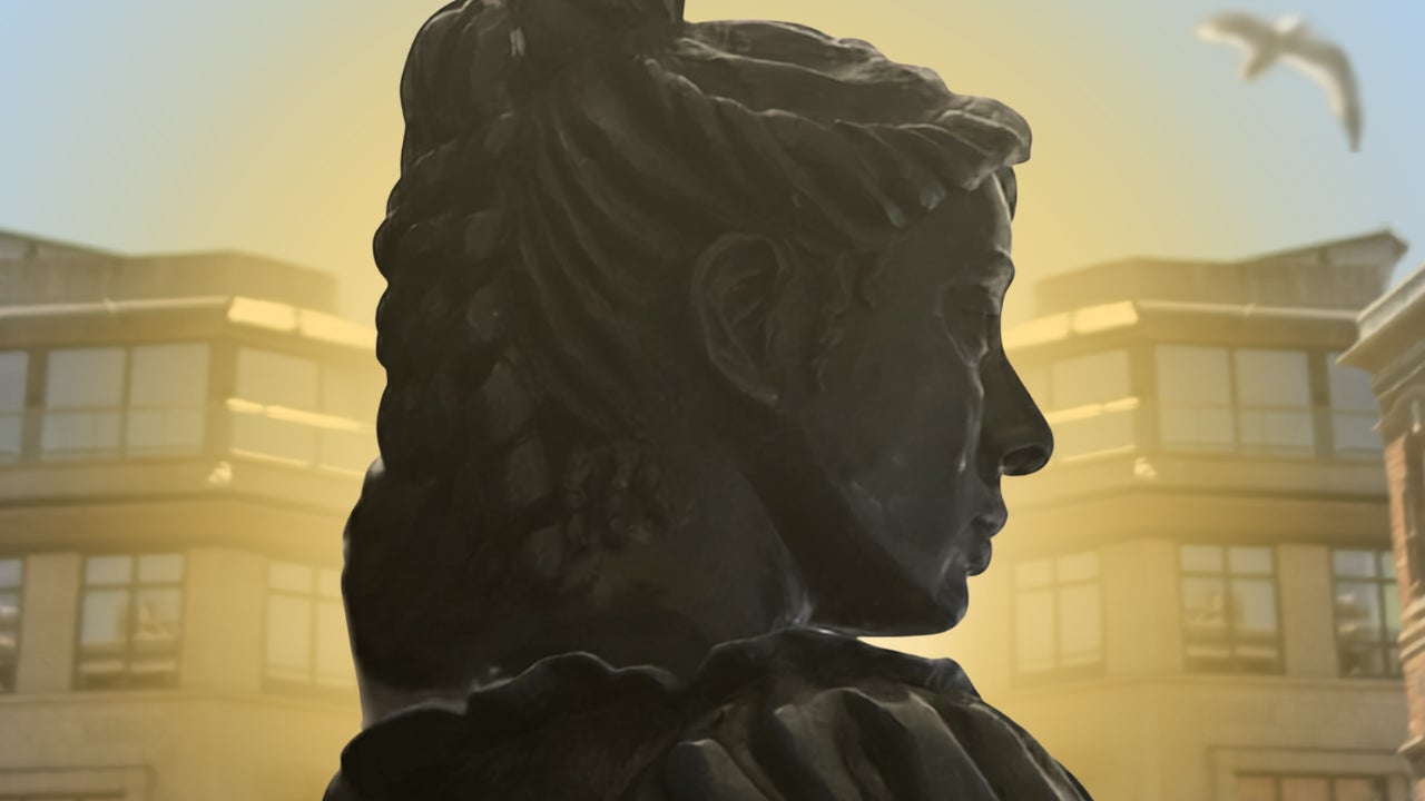 Temple Bar The Musical at Smock Alley - head and shoulders of a dark statue seen from the side with office type buildings in the background.
