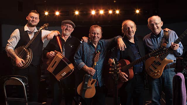 The Fureys, Farewell Tour. 5 smiling men in a line, resting on each others shoulders, holding various musical instruments.