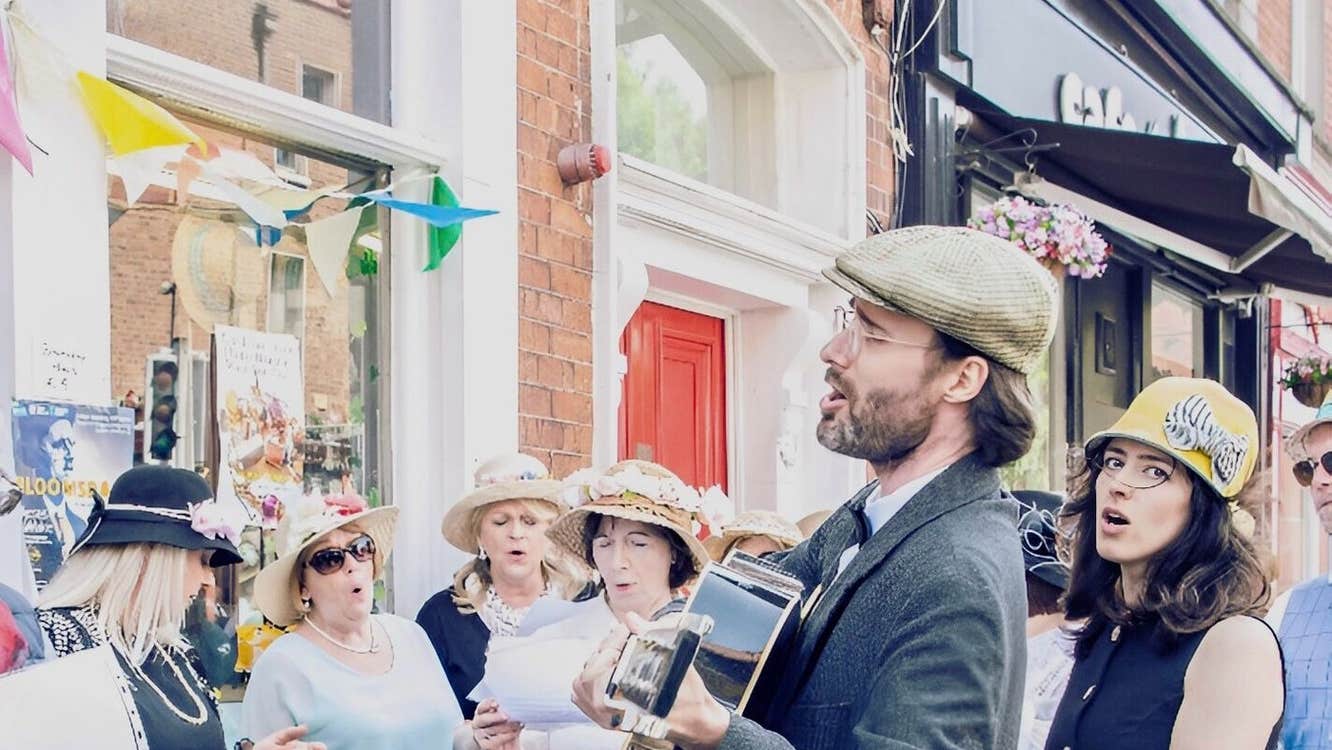 A group of people singing as part of a walking tour in Dublin City