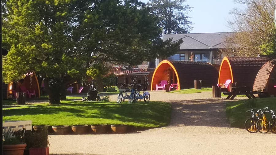 3 pods that open out onto a green area