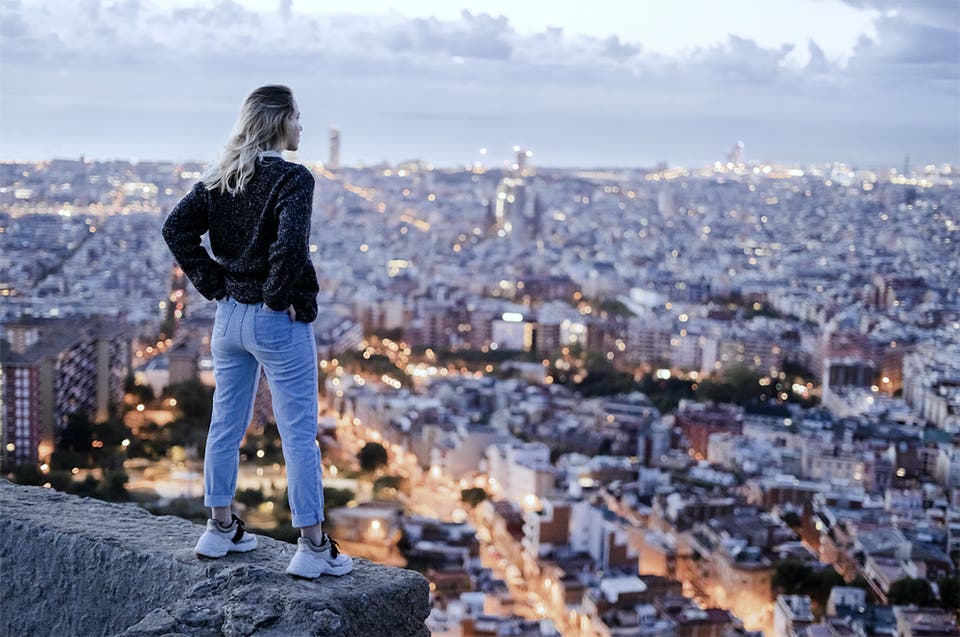 Women looking over city lights