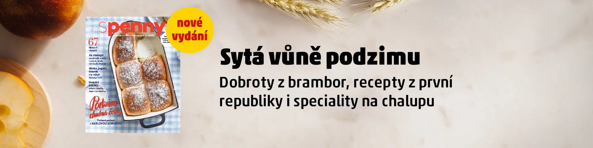 Banner propagující nové vydání časopisu S PENNY u stolu s titulkem „Sytá vůně podzimu“. Na obálce je obrázek čerstvě upečených domácích buchet s moučkovým cukrem. Titulky v časopisu se zaměřují na recepty z brambor, pokrmy z první republiky a speciality na chalupu.