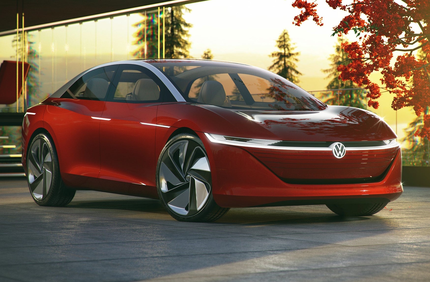 Red Volkswagen ID.Vizzion front-three quarter view with trees and hazy sun in the background