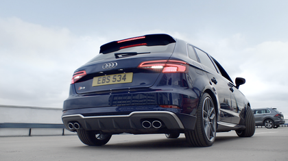 A blue Audi S3 from the back.