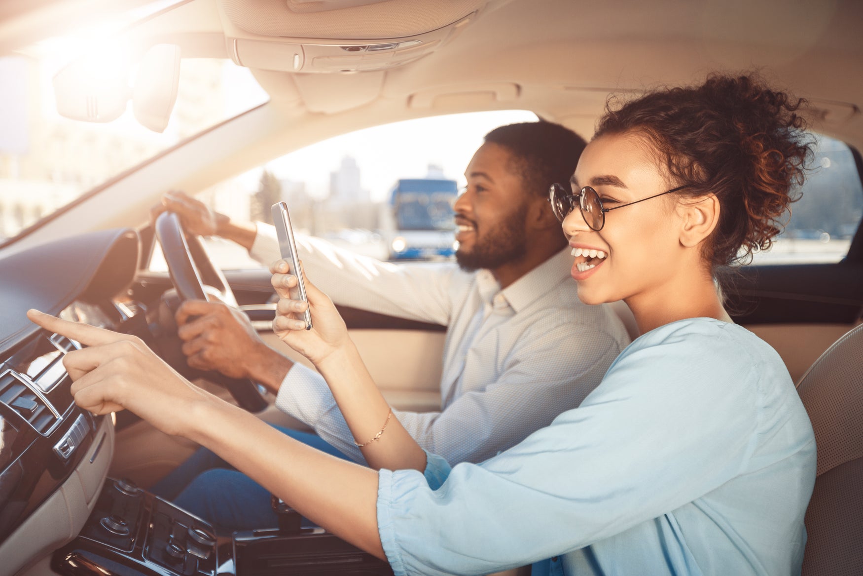 Couple singing in car