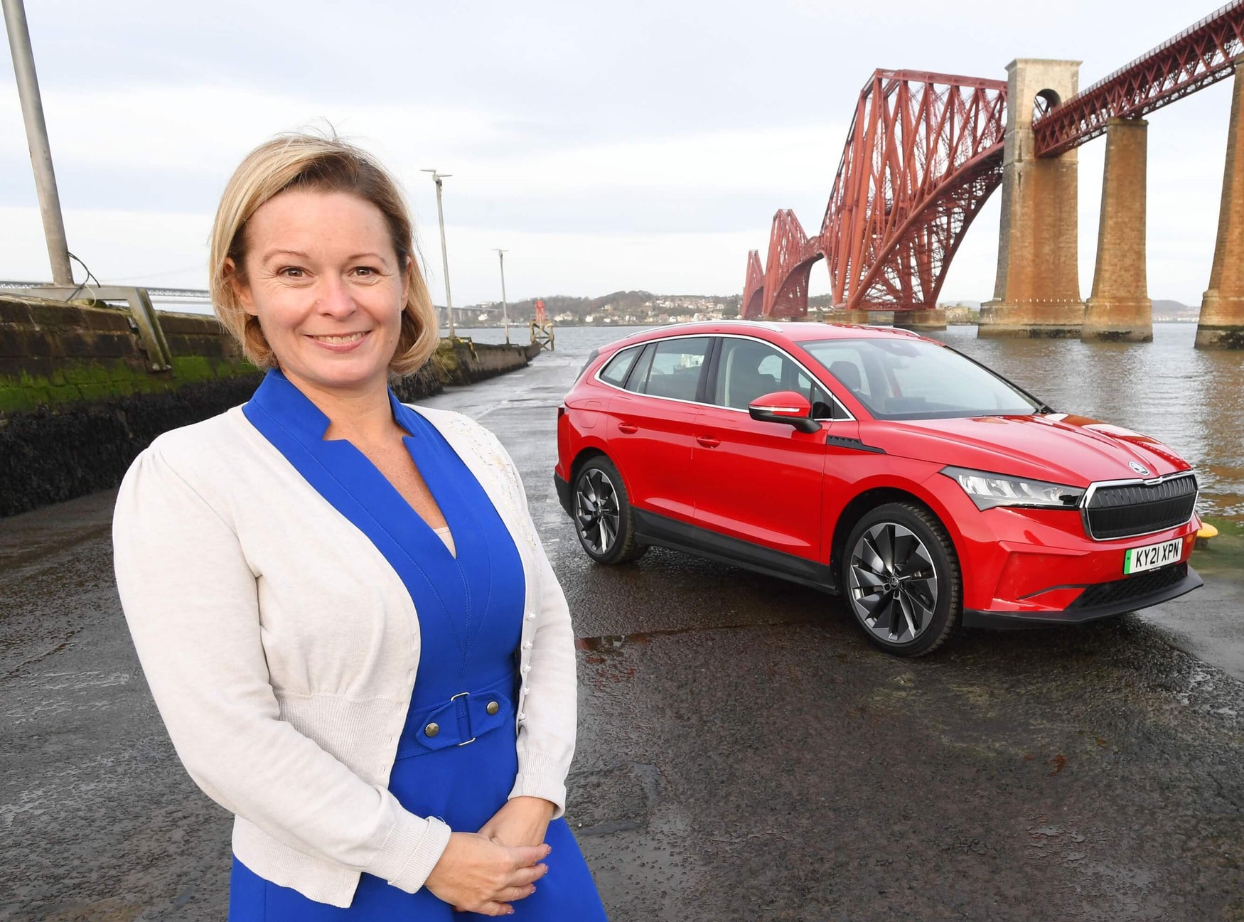 Kirsten Stagg, Head of Marketing at Skoda UK, stood in front of a red Skoda 